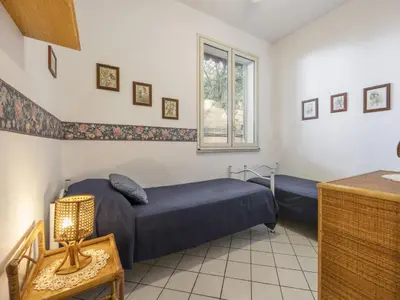 a bedroom with two beds and a window at Apartment Cicladi Amorgos by Interhome in Santa Flavia