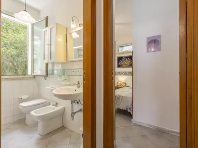 a bathroom with a sink and a toilet and a sink at Apartment Cicladi Anafi by Interhome in Santa Flavia