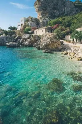 a body of water with rocks and a beach at Dai Nonni in Terrasini