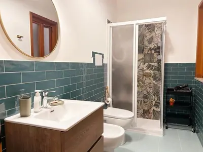 a bathroom with a toilet and a sink and a shower at Dai Nonni in Terrasini