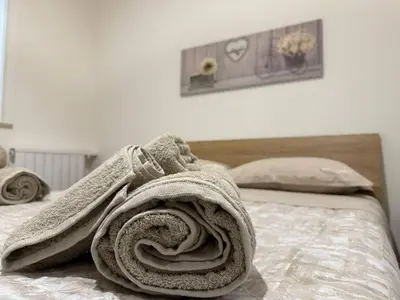 a towel is wrapped on top of a bed at Casa Francesca in Capaci