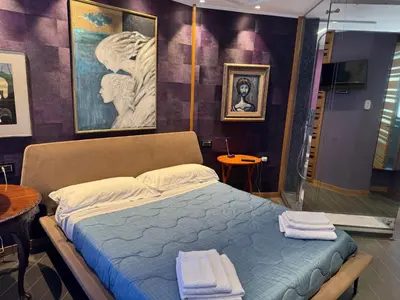 a bedroom with a bed with towels on it at Amari 124 in Palermo