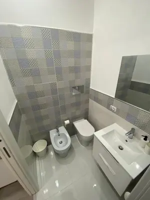 a bathroom with a toilet and a sink at Palazzo Castelli alla Zisa in Palermo