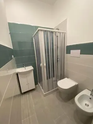a bathroom with a shower and a toilet and a sink at Palazzo Castelli alla Zisa in Palermo