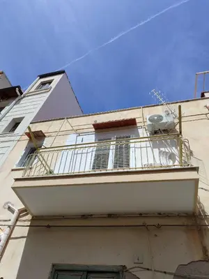 a balcony on the side of a building at MonSea in Palermo