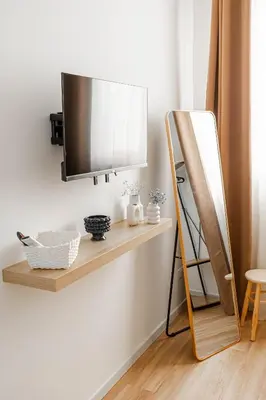 a shelf with a flat screen tv on a wall at MonSea in Palermo