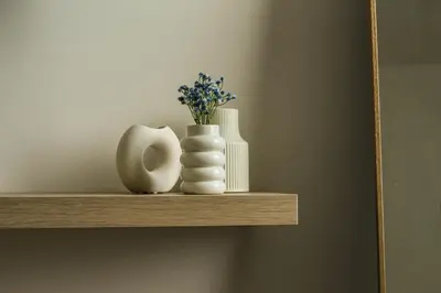 a shelf with two vases and flowers on it at MonSea in Palermo