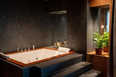 a bathroom with a staircase and a potted plant at Le Dimore - Ponte 7 in Palermo