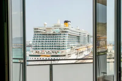 a cruise ship in the ocean viewed from a window at Le Dimore - Ponte 7 in Palermo