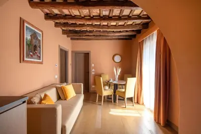 a living room with a couch and a table at Palazzo De Gregorio - Apartments in Palermo