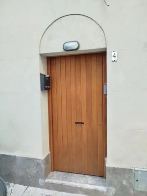 a wooden door in the side of a building at Capo Sweet Home in Palermo