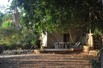 a house with a table and chairs in front of it at Casa Panoramica in Terrasini