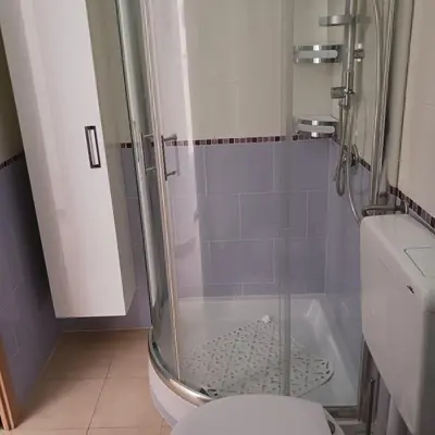 a bathroom with a shower with a toilet at Villetta al villaggio 101 pini in Campofelice di Roccella