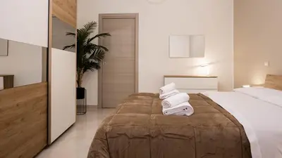 a hotel room with a bed with towels on it at Leonetti in Carini