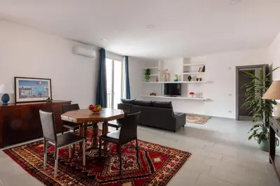 a living room with a table and a couch at Civico 61 in Palermo