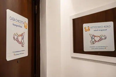 a door with a sign that reads autotron and the national band at Casa Chicotta- Libertà in Palermo