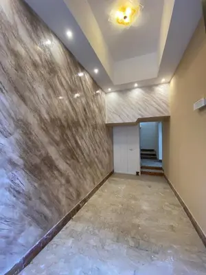 an empty lobby with a marble wall at I Conti della Zisa in Palermo