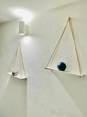 two shelves on the wall with spheres on them at Blue Charm Exclusive Apartment in Palermo
