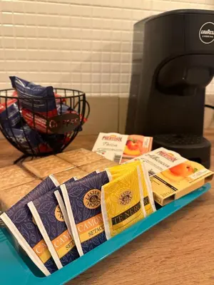 a tray filled with different types of food on a counter at Blue Charm Exclusive Apartment in Palermo