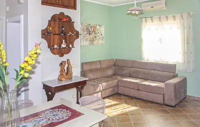 a living room with a couch and a table at Stunning Home In Trabia in Trabia