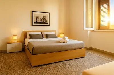 a bedroom with a bed with a teddy bear on it at GoriziaHome in Palermo