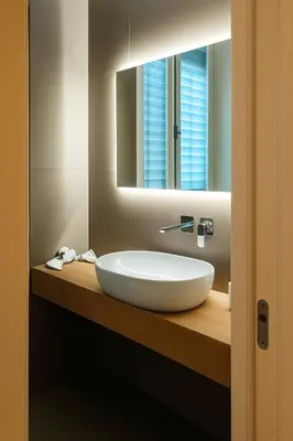 a bathroom with a white sink and a mirror at GoriziaHome in Palermo
