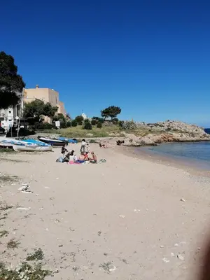 a group of people sitting on a beach at Terrazza al mare in Santa Flavia
