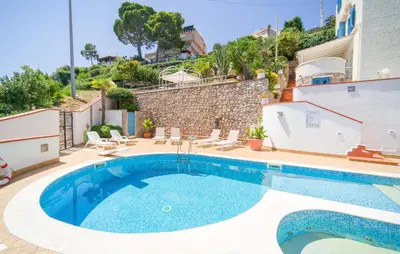 a villa with a swimming pool and a house at Nice Home In Altavilla Milicia in Altavilla Milicia