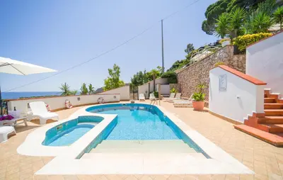 a swimming pool in the middle of a patio at Nice Home In Altavilla Milicia in Altavilla Milicia