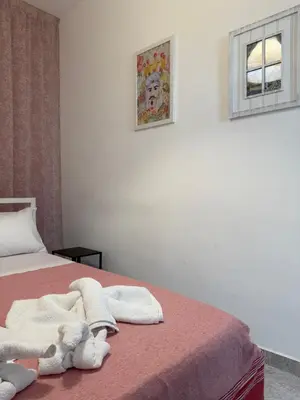 a bedroom with a bed with towels on it at Appartamento Nonna Rosalba in Palermo