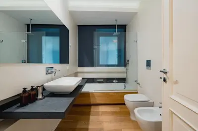 a bathroom with two sinks and two toilets at Santa Sofia con Terrazza by Wonderful Italy in Palermo