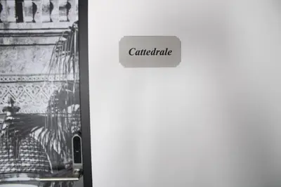 a white refrigerator with a sign that reads centric at Dimora Garibaldi in Palermo