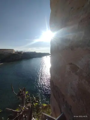 a view of a river with the sun in the sky at Casa Kialy in Terrasini