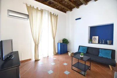 a living room with a couch and a tv at iFlat Casa Riccino in Palermo