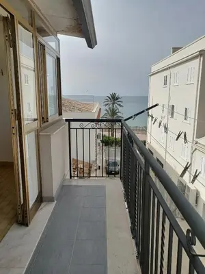 a balcony with a view of the ocean at Albachiara in Balestrate