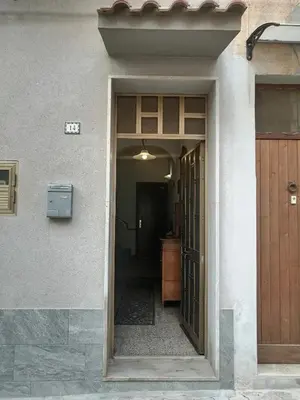 an entrance to a house with a door and a hallway at Albachiara in Balestrate