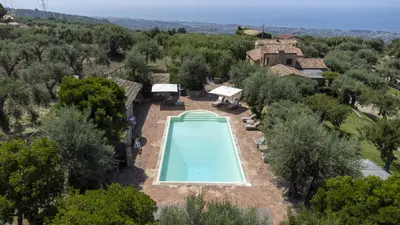 an aerial view of a house with a swimming pool at Villa Passulunara 14 by Massimo Villas in Lascari