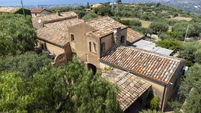 an aerial view of an old house with tile roofs at Villa Passulunara 14 by Massimo Villas in Lascari