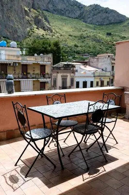 a table with two martini glasses on top of a table at casa Fontana in Capaci