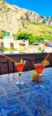 a table and two chairs sitting on a roof at casa Fontana in Capaci