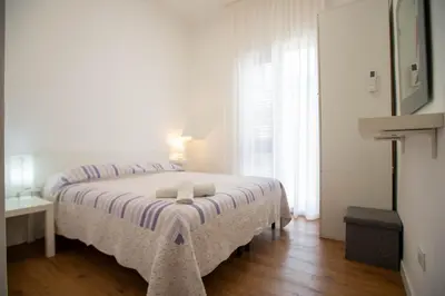 a bedroom with a bed with two towels on it at Da Jaco in Castellammare del Golfo