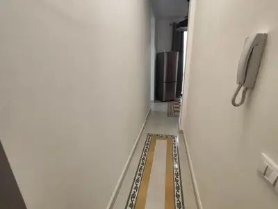 a hallway with a phone in a room at Palazzo Orangea 1 piano in Bagheria