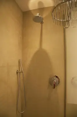 a shower stall with a shower head in a bathroom at Rosalmar B&B in Palermo