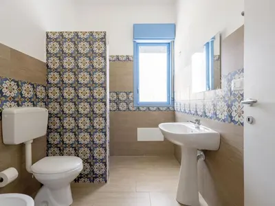 a bathroom with a toilet and a sink at Apartment Pietra Marina by Interhome in Balestrate