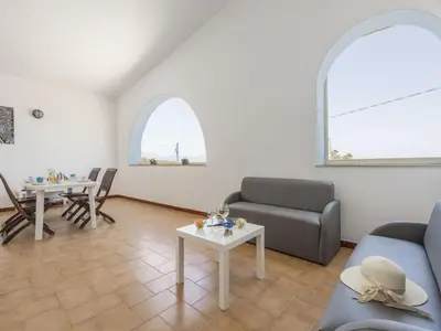 a living room with a couch and a table at Apartment Terrazza sul Mare by Interhome in Balestrate
