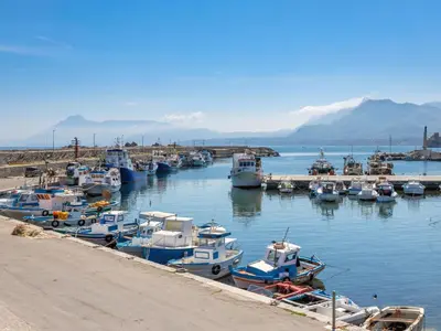 a bunch of boats are docked in a harbor at Apartment Cicladi Naxos by Interhome in Santa Flavia