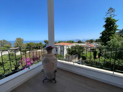 a vase sitting on a balcony with a view at Appartanvilla Magellano in Mondello