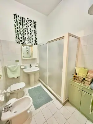 a bathroom with a toilet and a sink and a shower at Da Turiddu in Cinisi