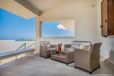 a living room with chairs and a table at Oasi delle Nereidi in Alcamo