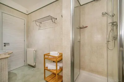 a bathroom with a shower and a toilet and a sink at Oasi delle Nereidi in Alcamo